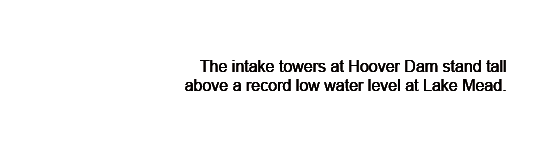 The intake towers at Hoover Dam stand tall above a record low water level at Lake Mead. 
