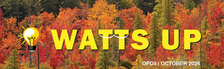 A bright yellow light bulb icon with the text “WATTS UP" in bold yellow letters is set against a background of colorful autumn trees with red, orange, and green leaves, along with the text "OPD5 | OCTOBER 2026" in white. Description generated by AI